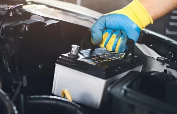 Can you put a new car battery with an old one?